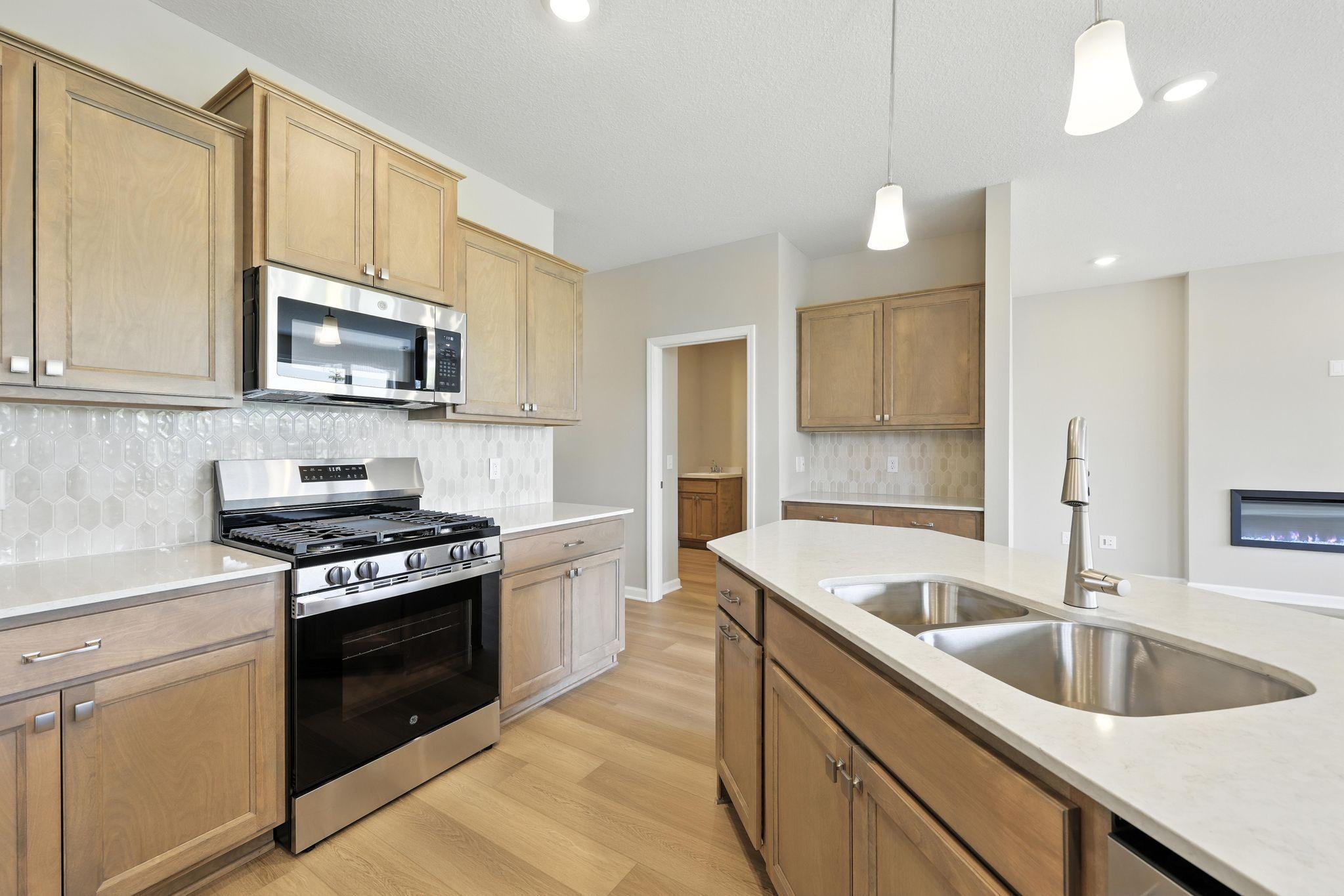 Kitchen *Photo of a previously built home of the same floor plan. Finishes/options may vary.