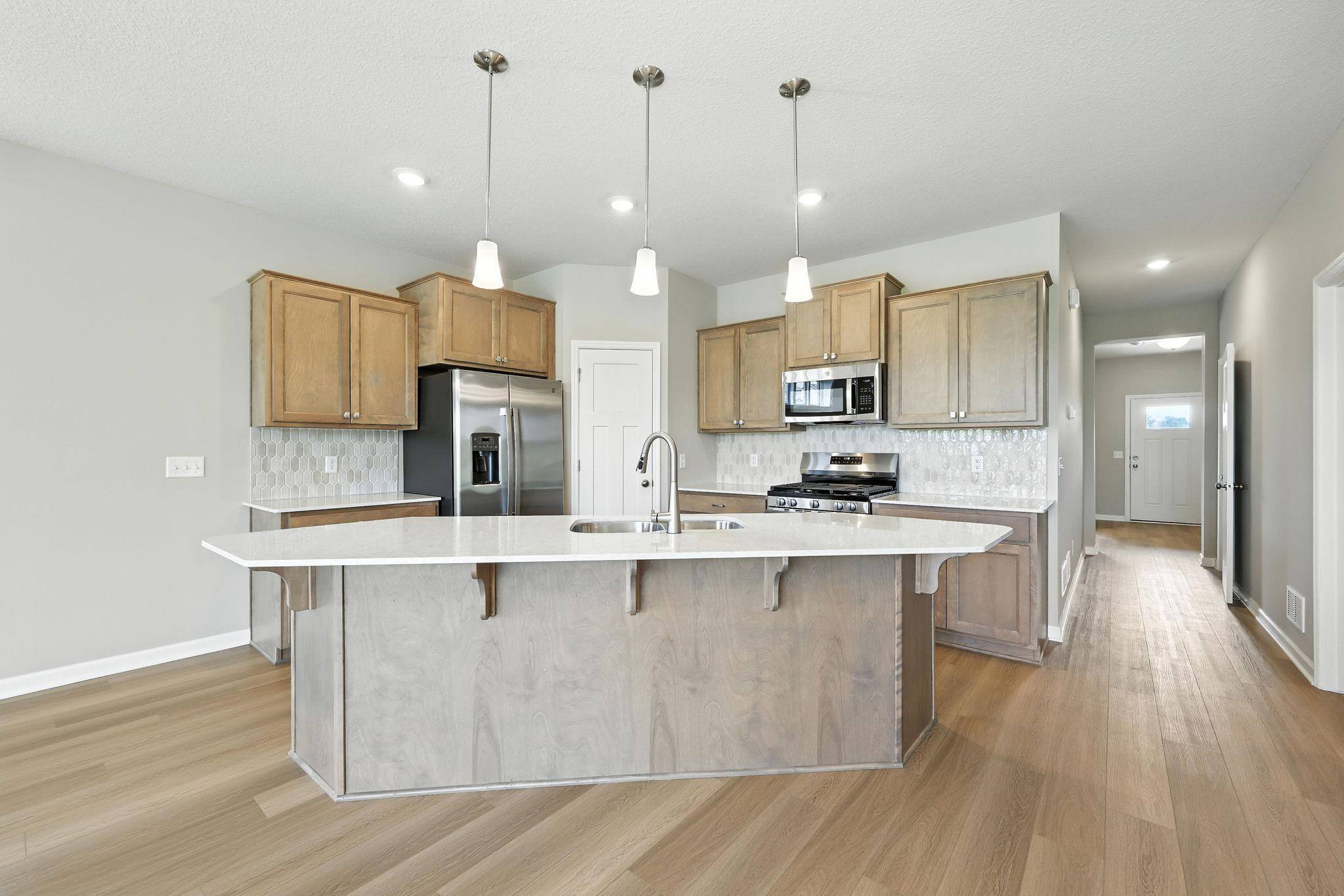 Kitchen *Photo of a previously built home of the same floor plan. Finishes/options may vary.