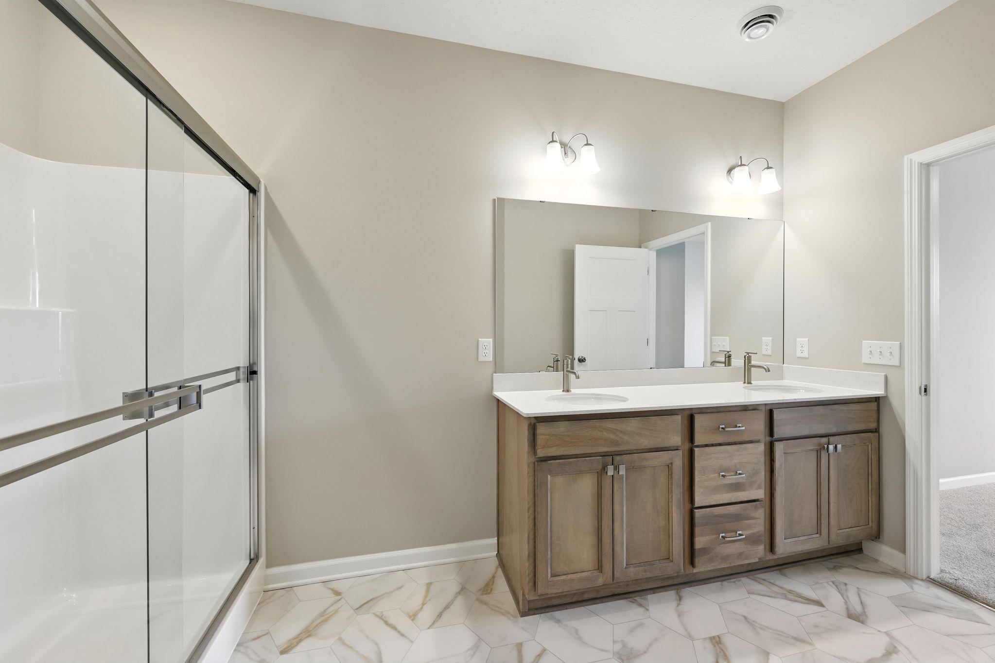 Owner's Bathroom *Photo of a previously built home of the same floor plan. Finishes/options may vary.