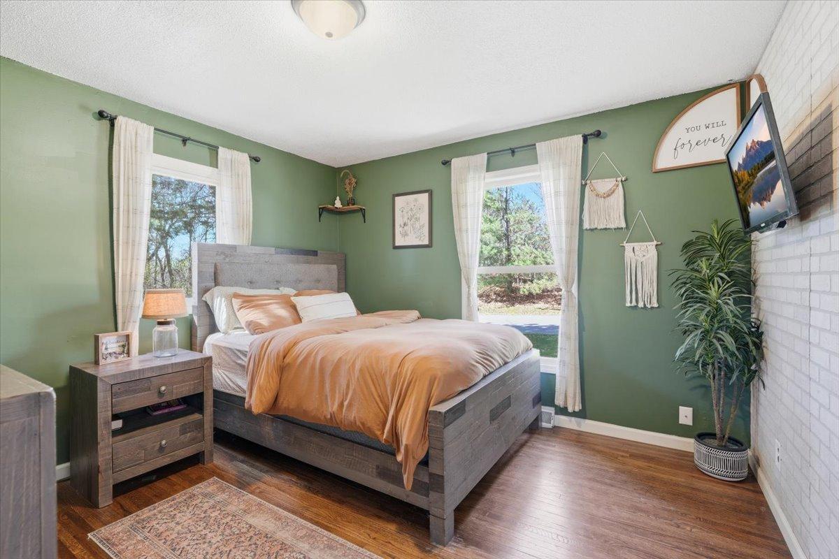 Main level primary bedroom is bright and airy!