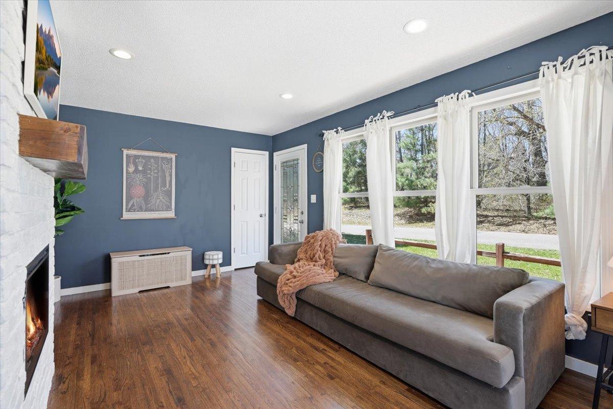 Welcome In - gorgeous wood floors and bright natural light greets you.