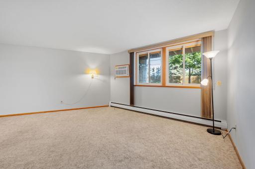 Inviting living room and views of the landscaped grounds.