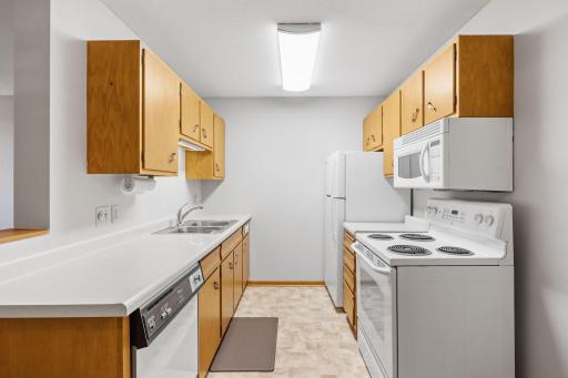 Functional kitchen with plenty of counter space and double sink.