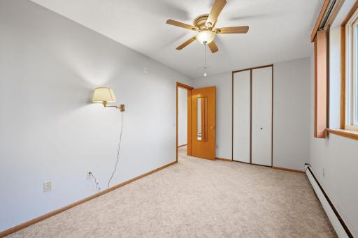 Primary bedroom featuring double closet and updated paint.