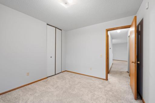 Bedroom with closet space and easy access to hallway.