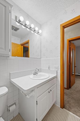 Bathroom vanity with ample counter space and bright lighting.