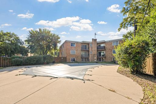 Pool View #2 â Spacious pool area with privacy fencing and mature trees.