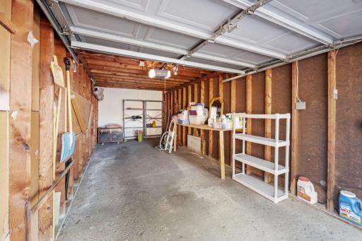 Garage Interior â Private garage with storage shelving included.