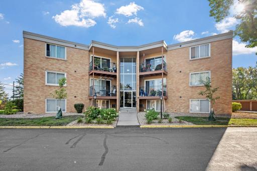 Rear entrance offers easy access with well-kept grounds cared for by the association.
