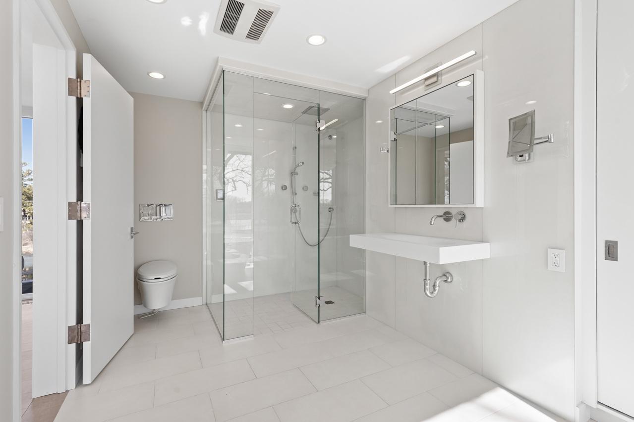 Walk-in shower - Toilet with a bidet seat with hot water and air.