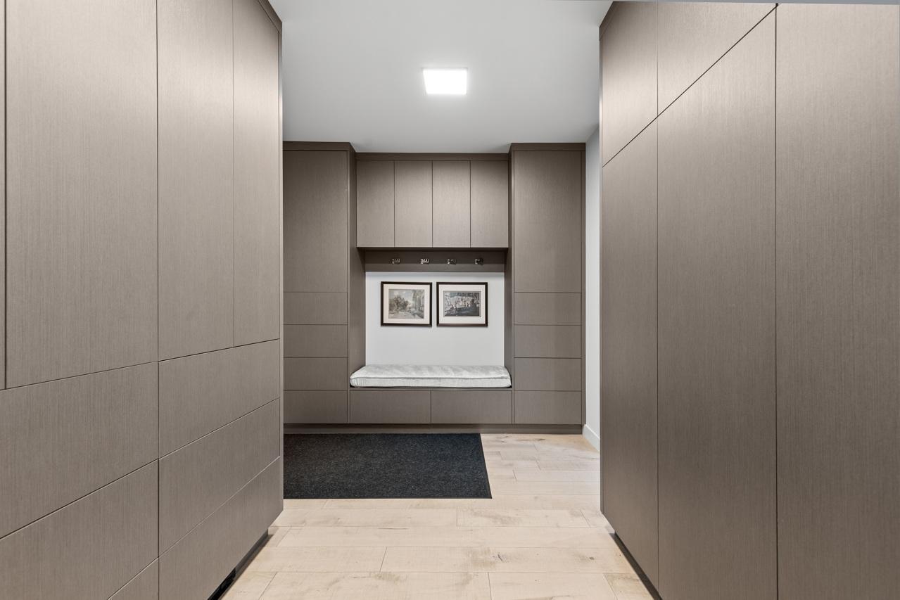 Mud room with a built-in bench and lockers