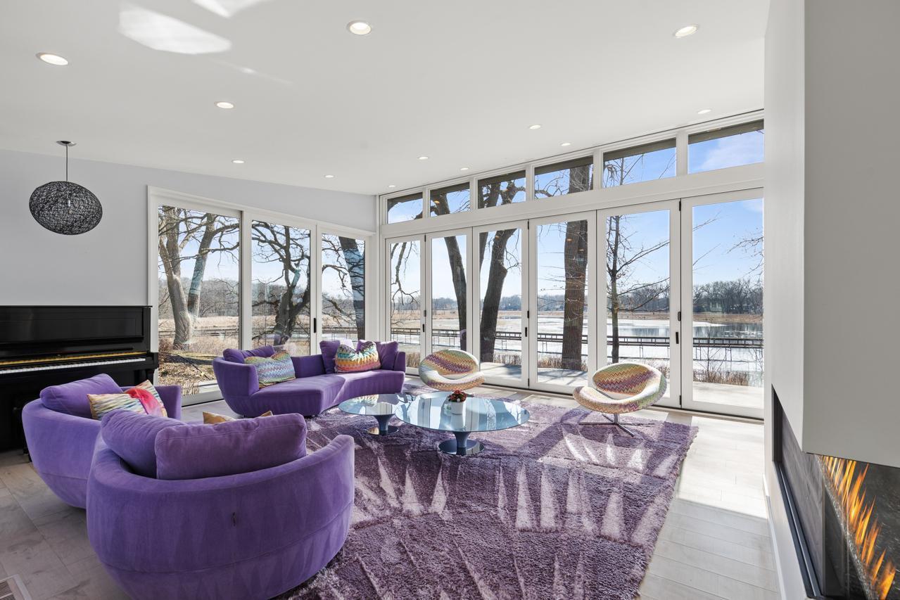 The living room offers abundant natural light and plenty of water views.