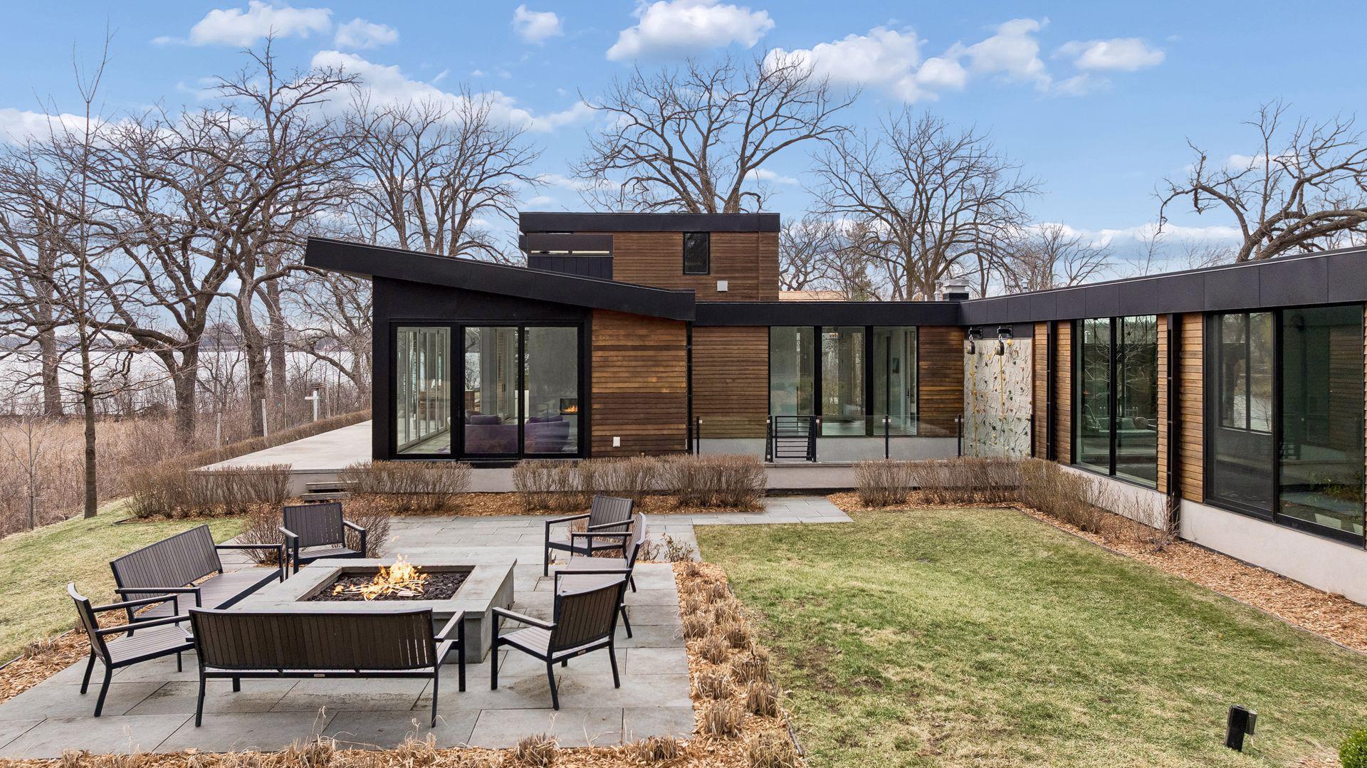 Spectacular Patio with Firepit and views of the lake. The firepit has a remote start with a timer for shut-off.