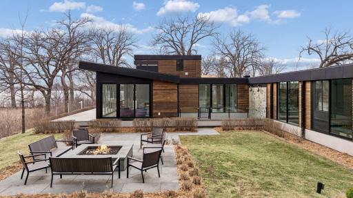 Spectacular Patio with Firepit and views of the lake. The firepit has a remote start with a timer for shut-off.
