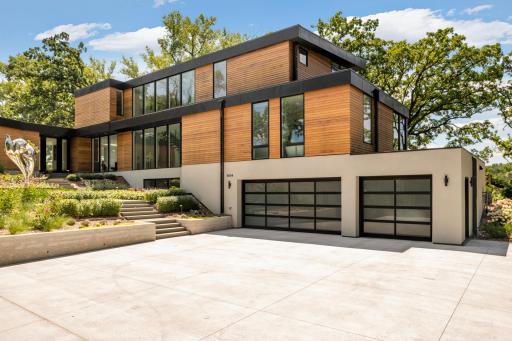 3-car attached garage with concrete driveway