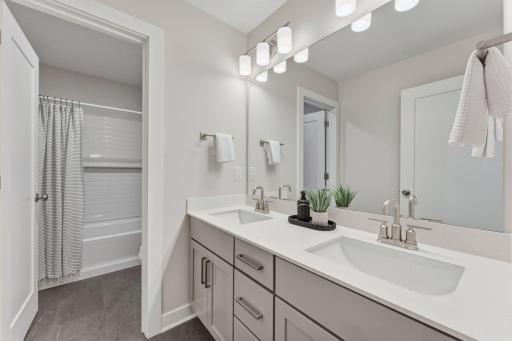 Upper level main full bathroom with dual vanities