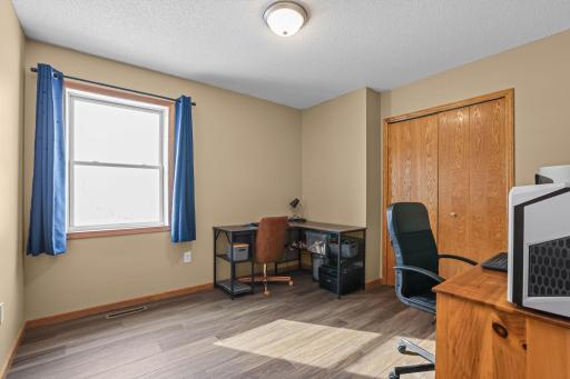 Bedroom 3 on upper level, currently set up as a spacious office