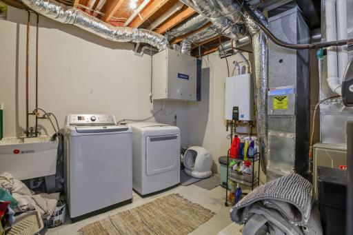 Oversized laundry/mechanical room with tankless water heater