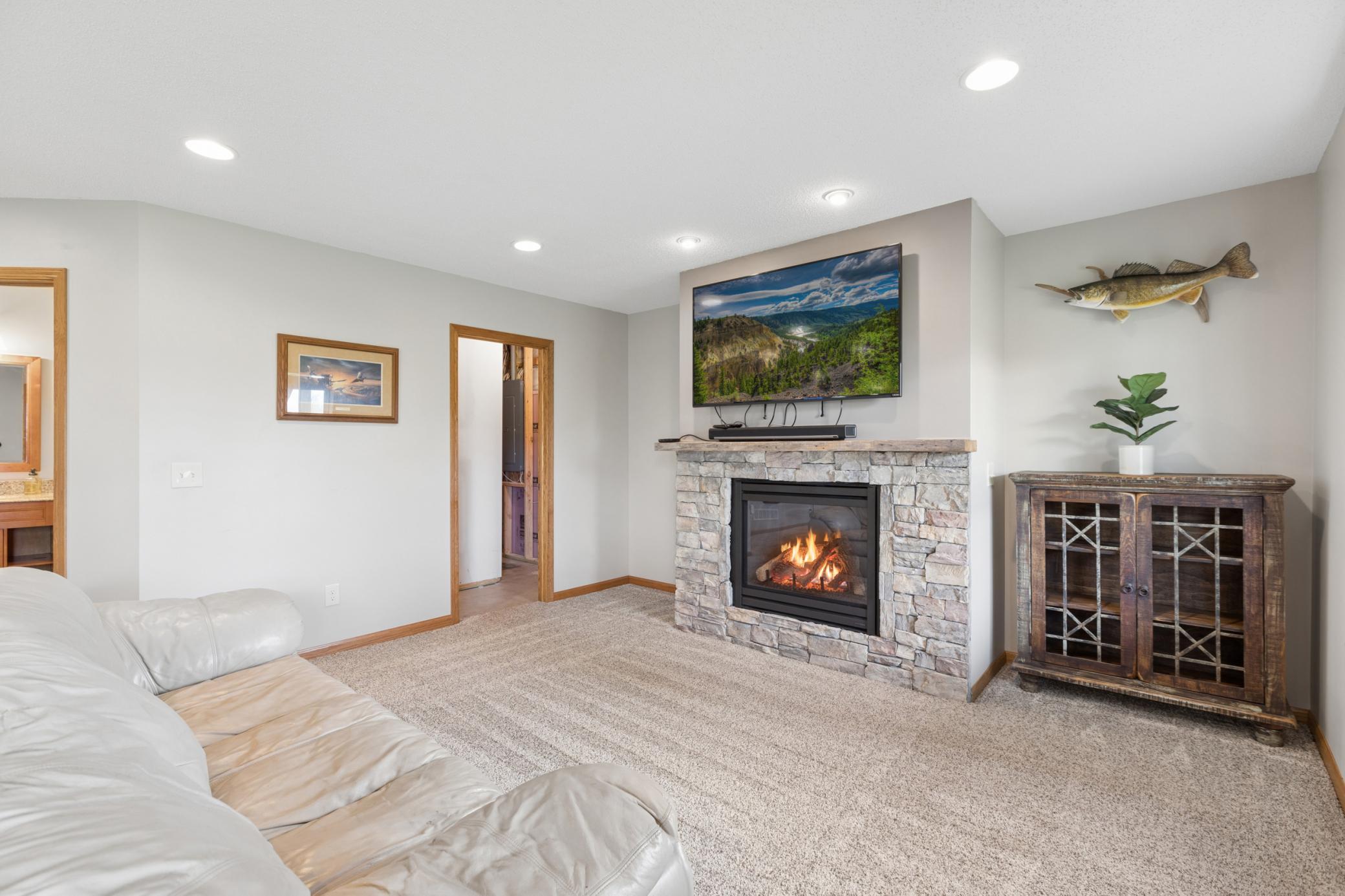 Lower level features a cozy gas fire