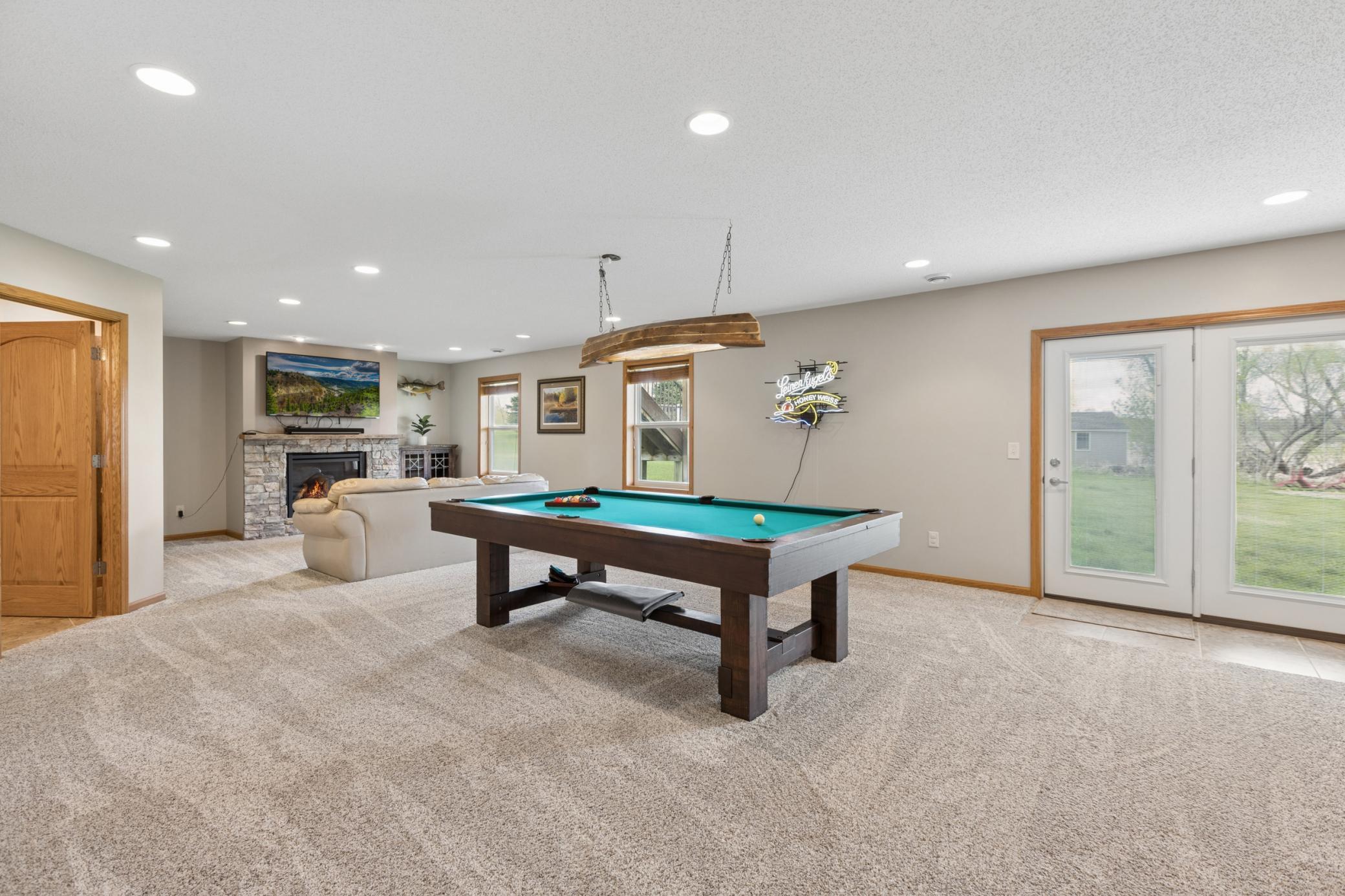 Lower level has lots of natural light and walks out to the private backyard.