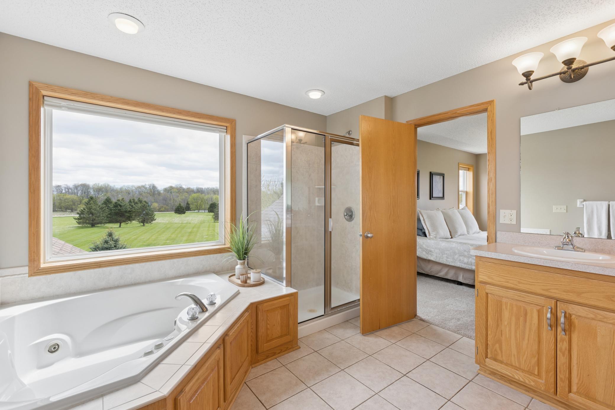 Primary bath has amazing views, large tub and separate shower