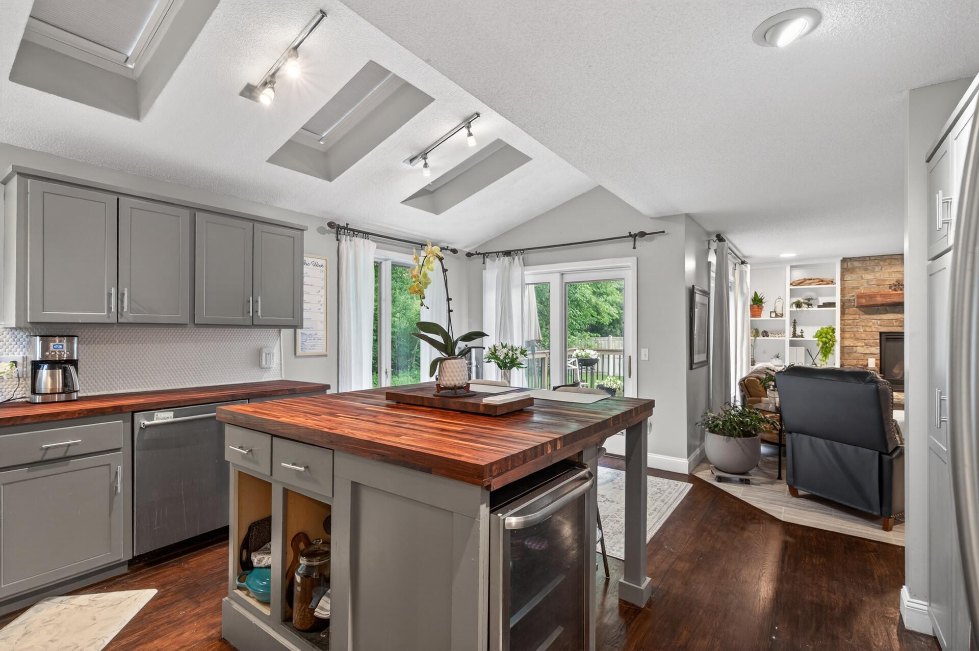 With new skylights, walnut counter tops and wooded views, the kitchen is a place you'll love to spend time!
