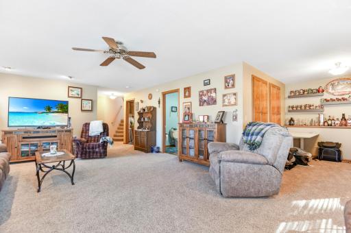 A game area is conveniently off the family room for open conversation and entertainment