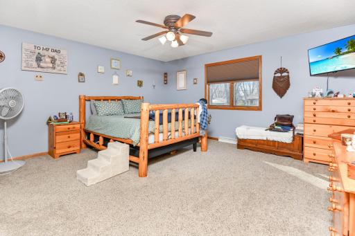 The generously sized primary suite features a large walk in closet & private bath