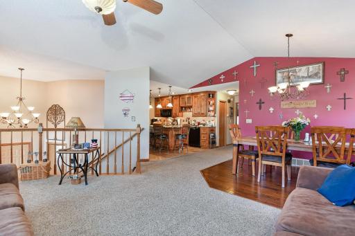 Vaulted ceiling and open entry area offers a warm and inviting feel