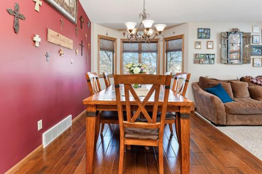 The dining area offers great natural lighting and is open to the kitchen and living