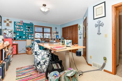 This 2nd lower level bedroom is currently used as a craft space ~ what a great use of space!