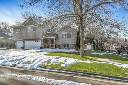 A large corner lot, beautifully adorned with mature trees & great curb appeal!