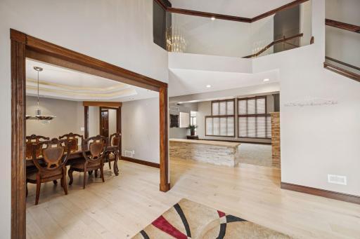 As you enter from the foyer, you’re greeted by beautifully installed, brand-new wood flooring that flows throughout the main level.