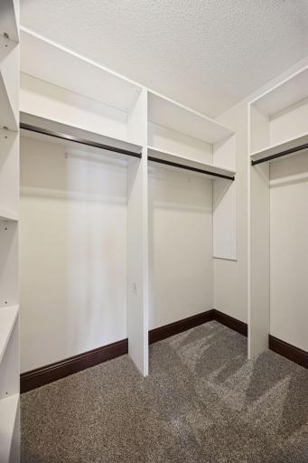 Newly installed closet organizers in all the walk-in closets