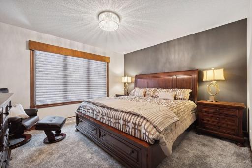 The upper-level bedroom includes a generous walk-in closet, offering plenty of storage space.