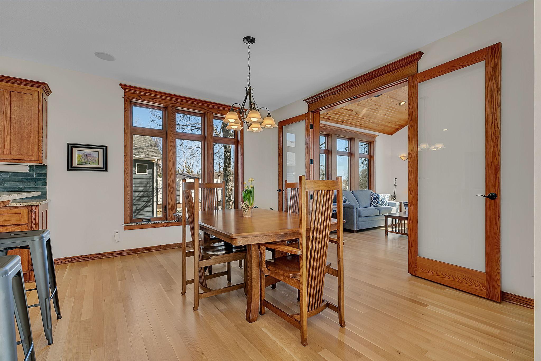 The dining area offers ample space for a large table, while the stunning hardwood floors seamlessly connect and unify the main-level living spaces.