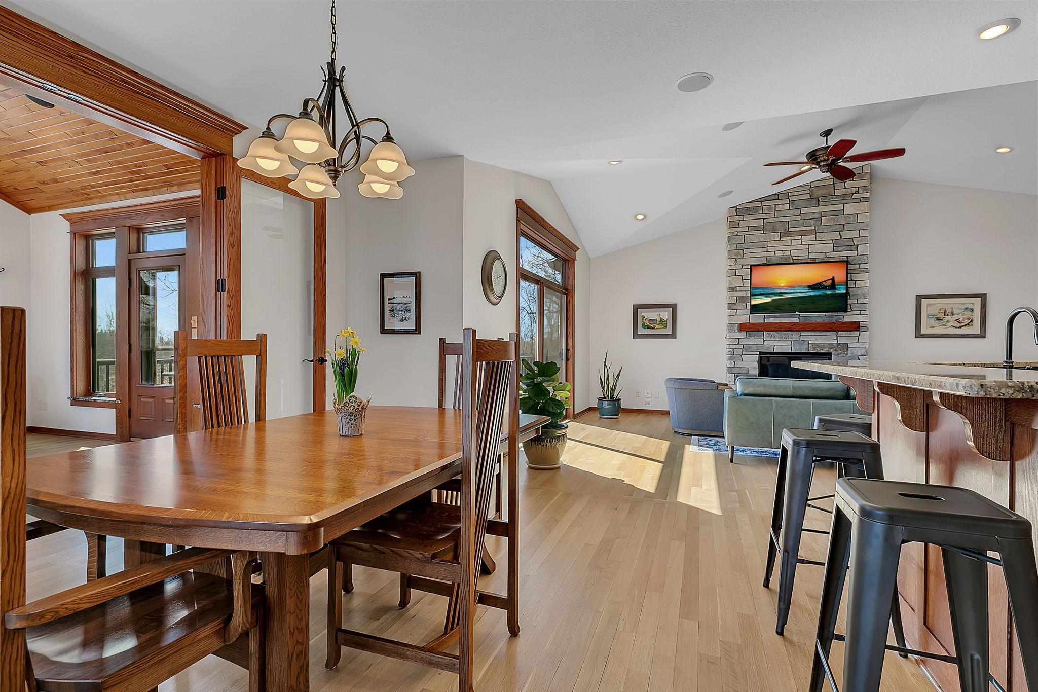 From the dining room, enjoy a view back into the living room, where large sliding glass doors fill the space with abundant natural light.