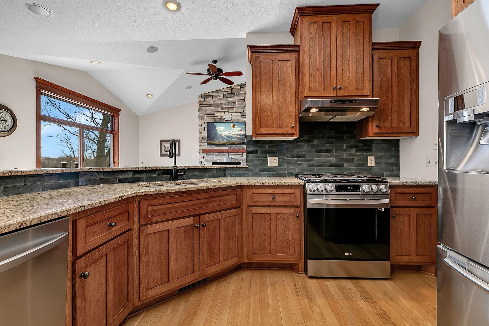 The kitchen sink overlooks the dining room, living room, and sunroom, making it easy to cook, entertain, and stay connected.
