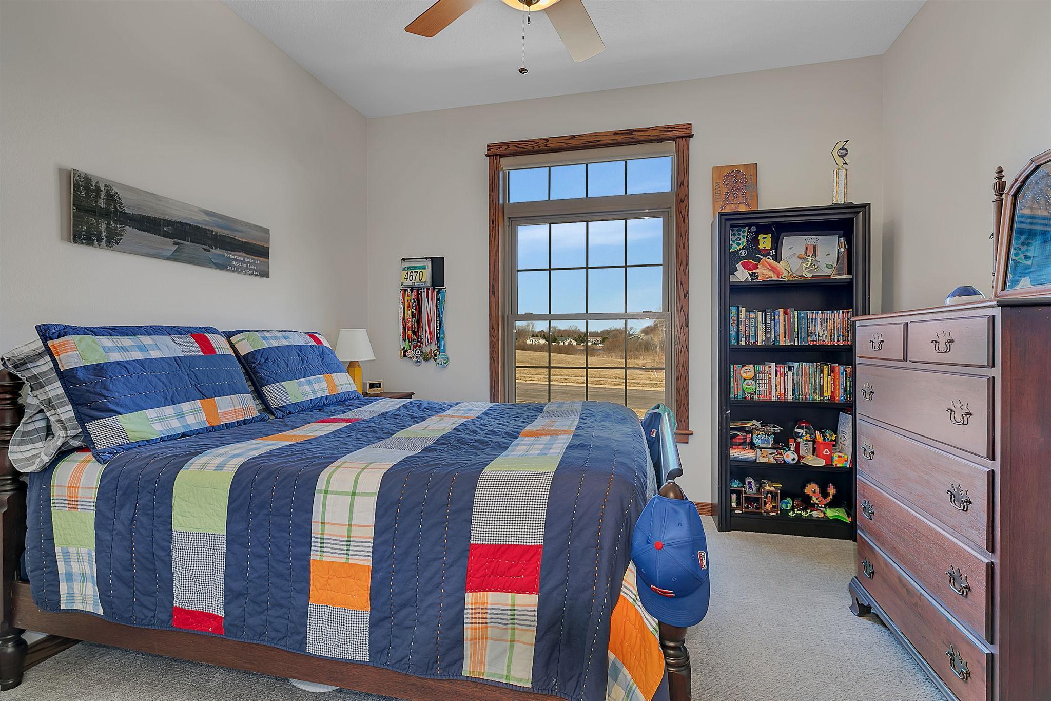 The third bedroom on the main level offers generous space and abundant closet storage, making it both comfortable and functional.