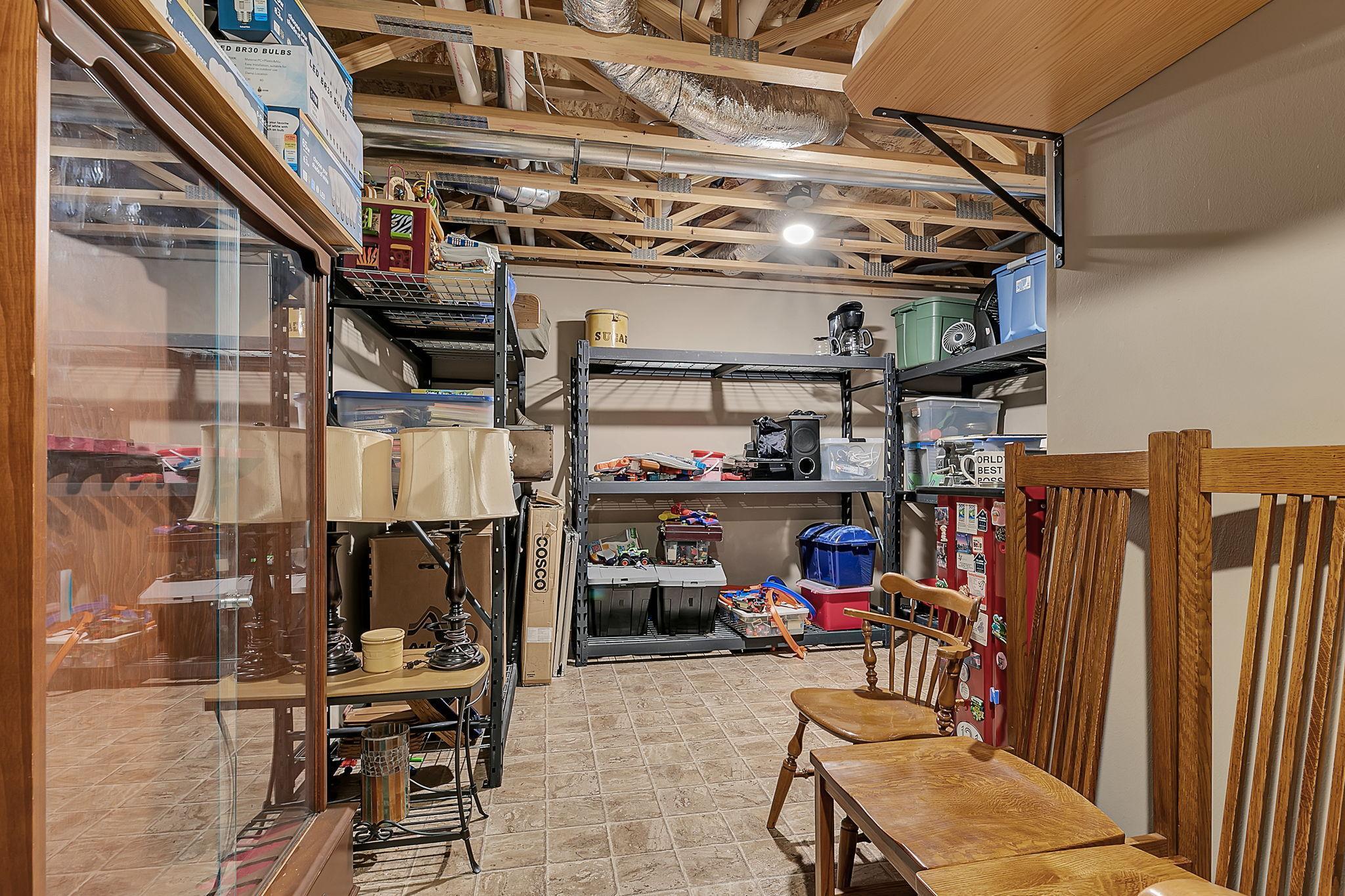 Functional utility room providing ample additional storage, great for keeping essentials organized and out of sight.