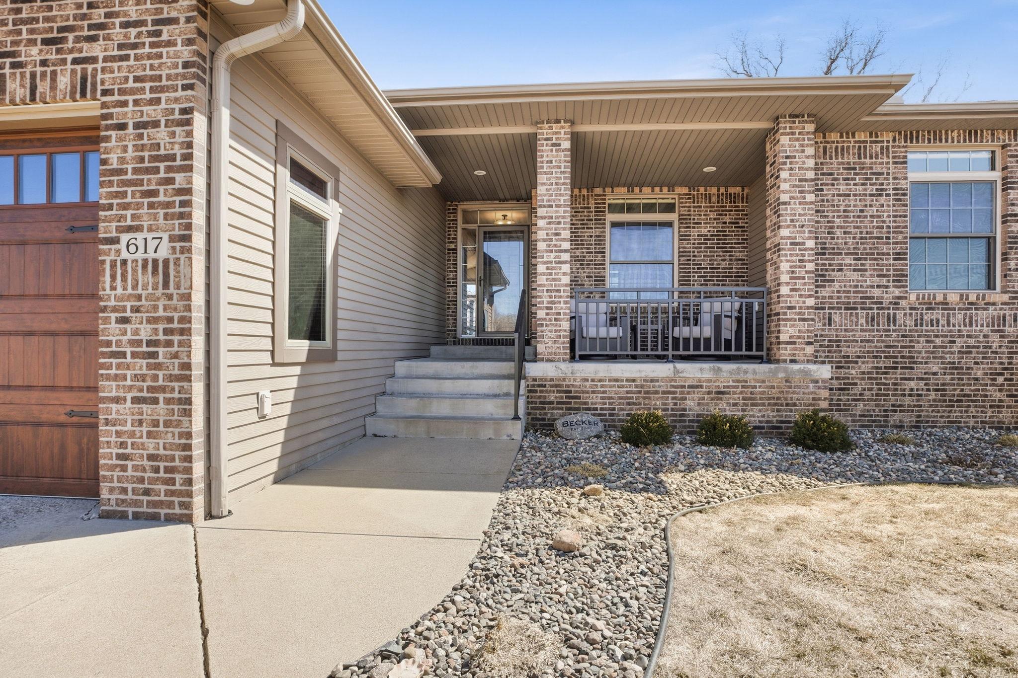 Inviting front sitting area, perfect for relaxing, greeting neighbors, or enjoying quiet moments outdoors.