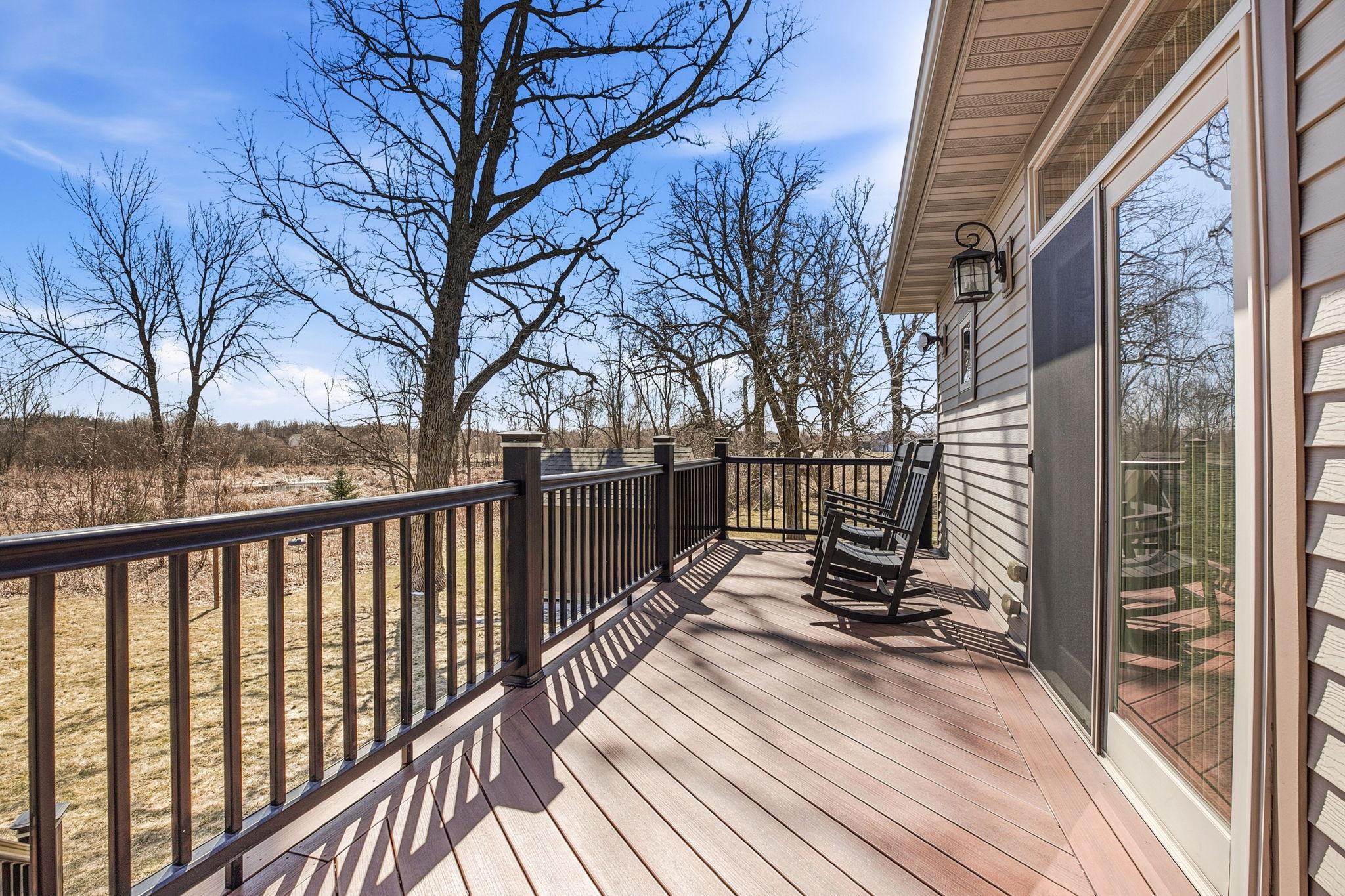 Another angle of the deck, showcasing the convenient entry to the primary bedroom and inviting outdoor space.