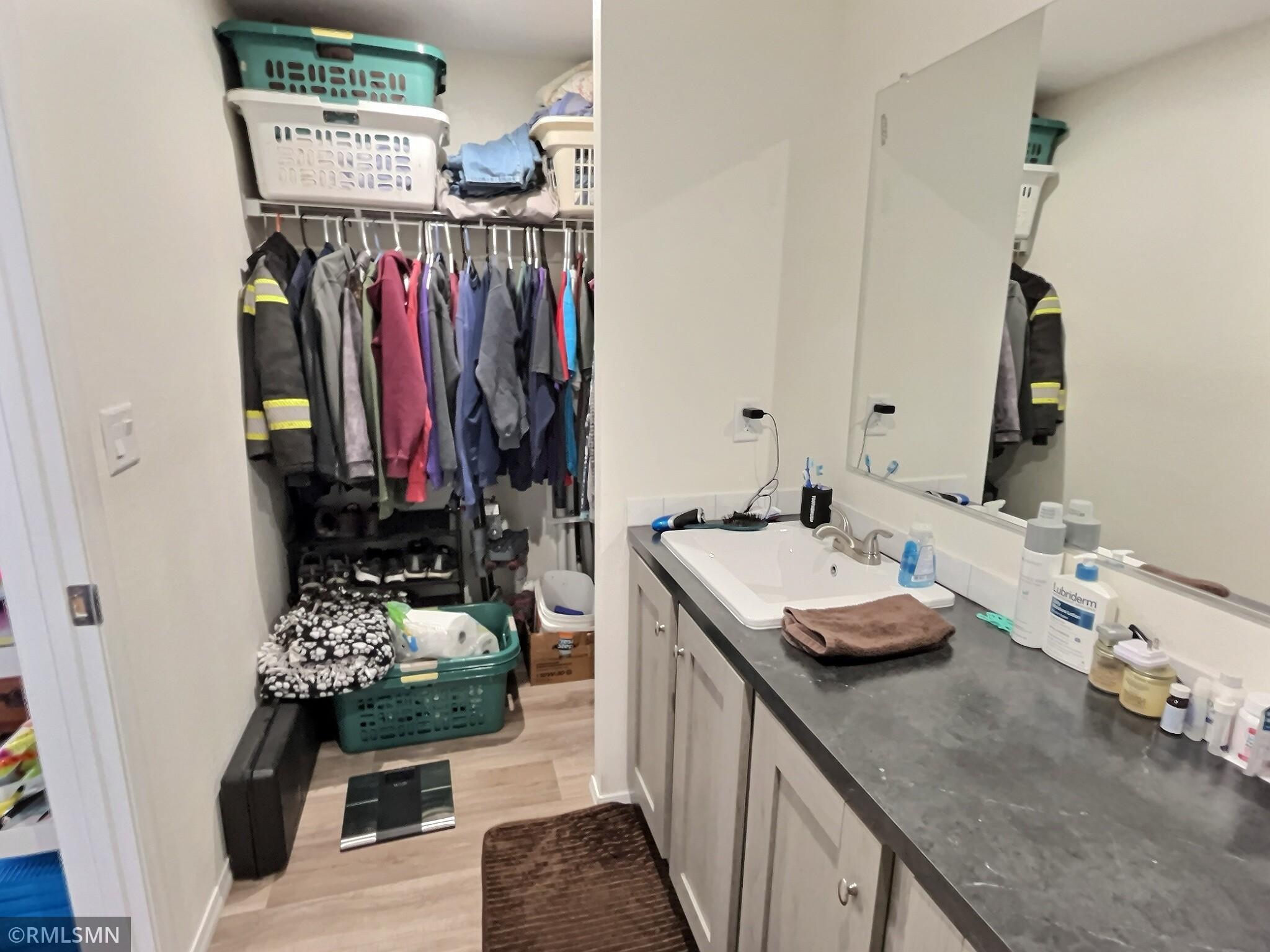 Spacious walk in closet and vanity in Primary.