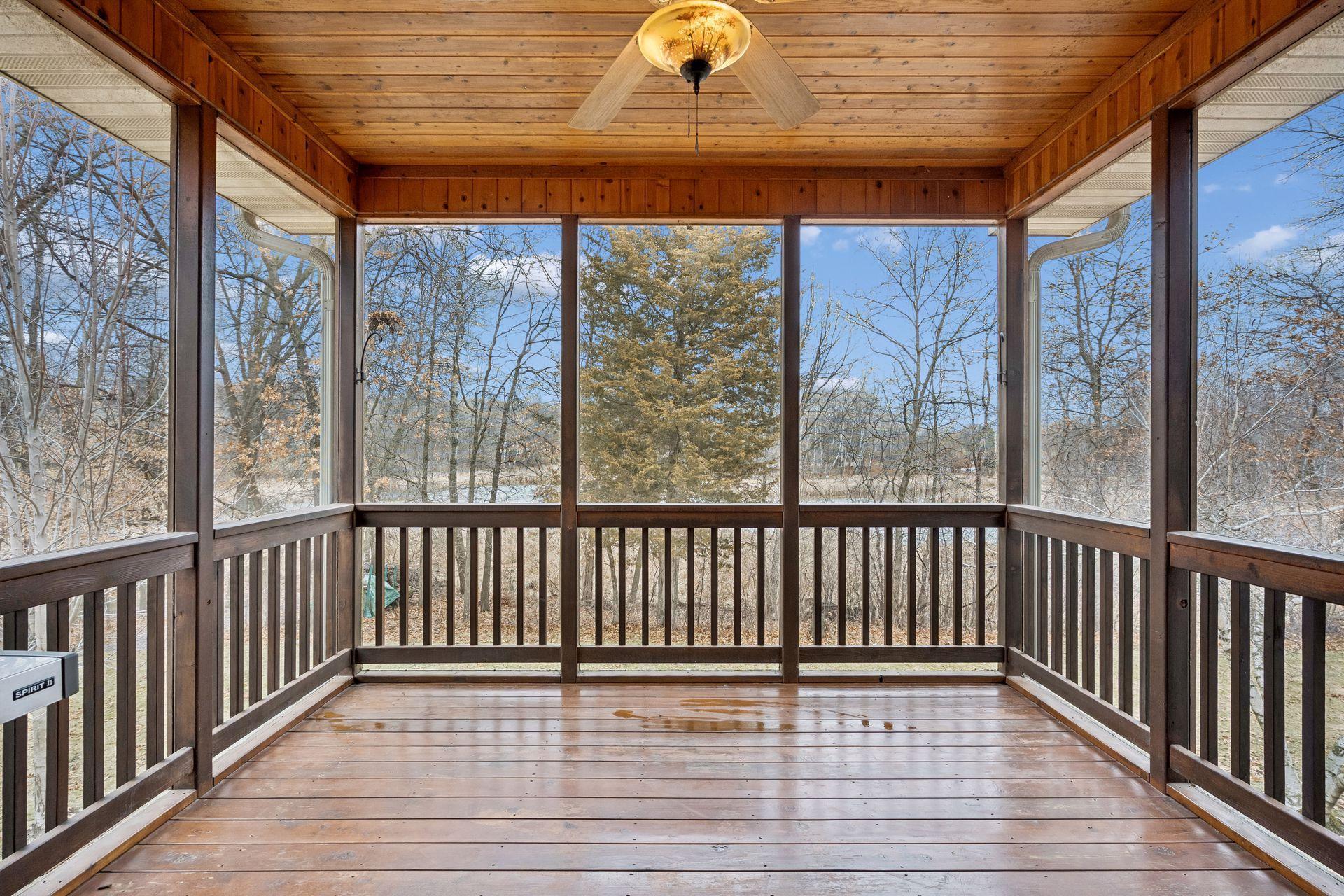 Screened-in porch with wetland views