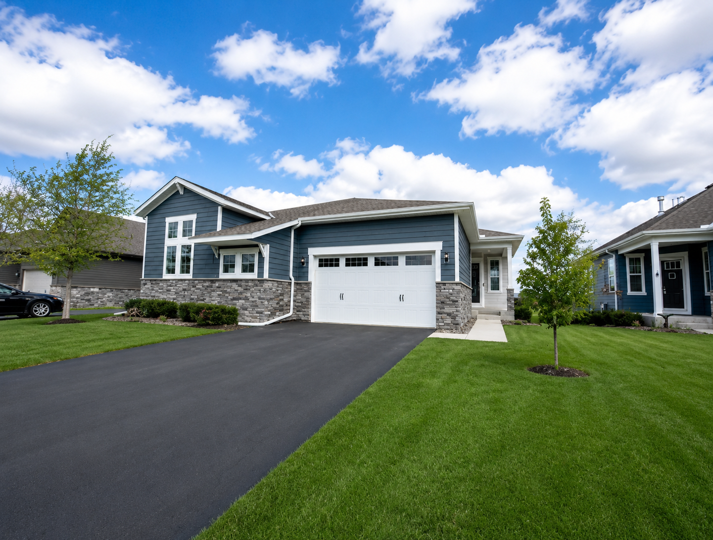 Asphalt driveway, 2 plus car garage, professionally landscaped...Welcome Home!