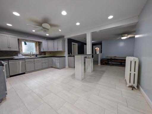 Functional kitchen with great flow, offering plenty of space to cook, gather, and make it your own.