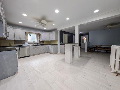 Functional kitchen with great flow, offering plenty of space to cook, gather, and make it your own.