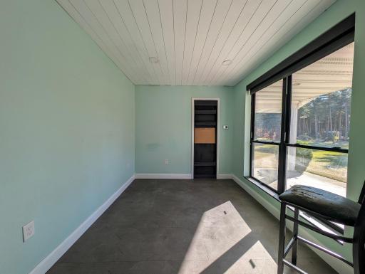 Office, with a view of the woods and front yard.