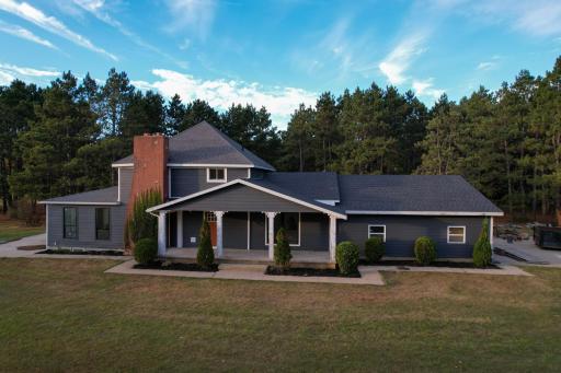 Charming exterior with new siding and updated windows, blending classic character with modern curb appeal.