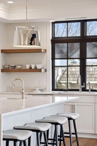 Beautiful floating shelves allow for additional storage or displaying decor